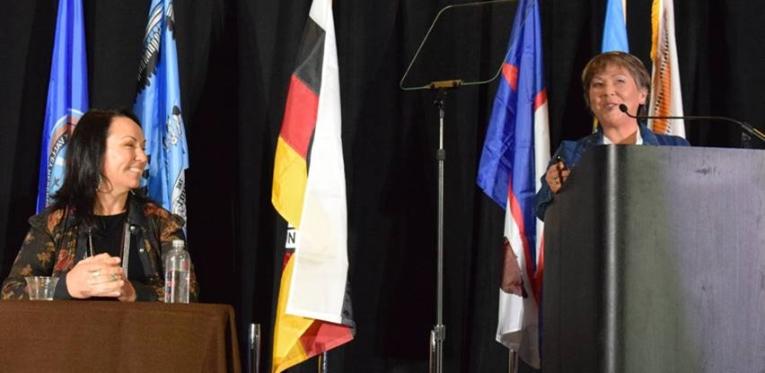 Person Standing at Podium on a stage